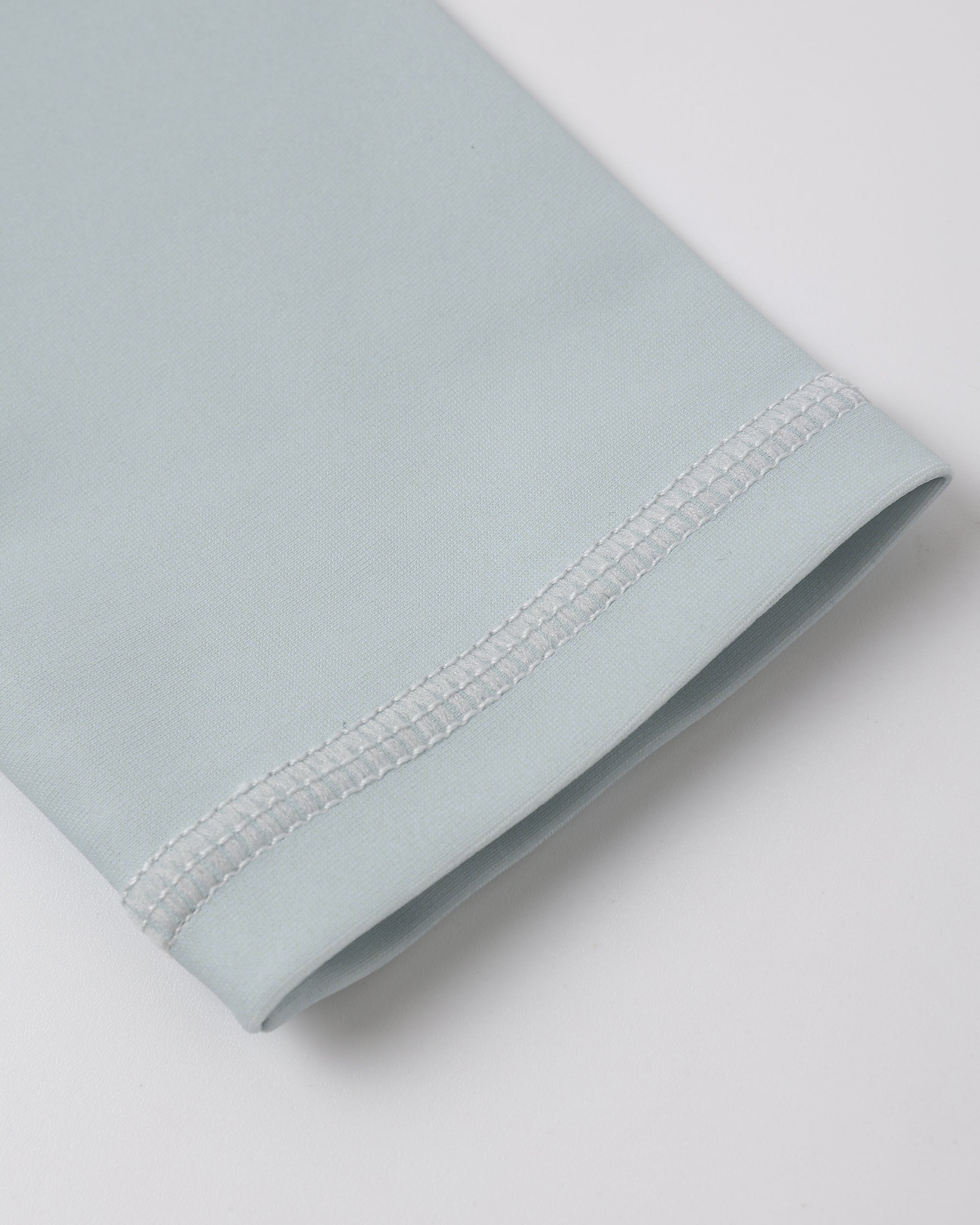 Close up of sleeve on the Long Sleeve Rashguard Seafoam | Rylee + Cru
