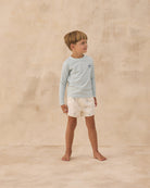 Boy wearing Long Sleeve Rashguard Seafoam | Rylee + Cru