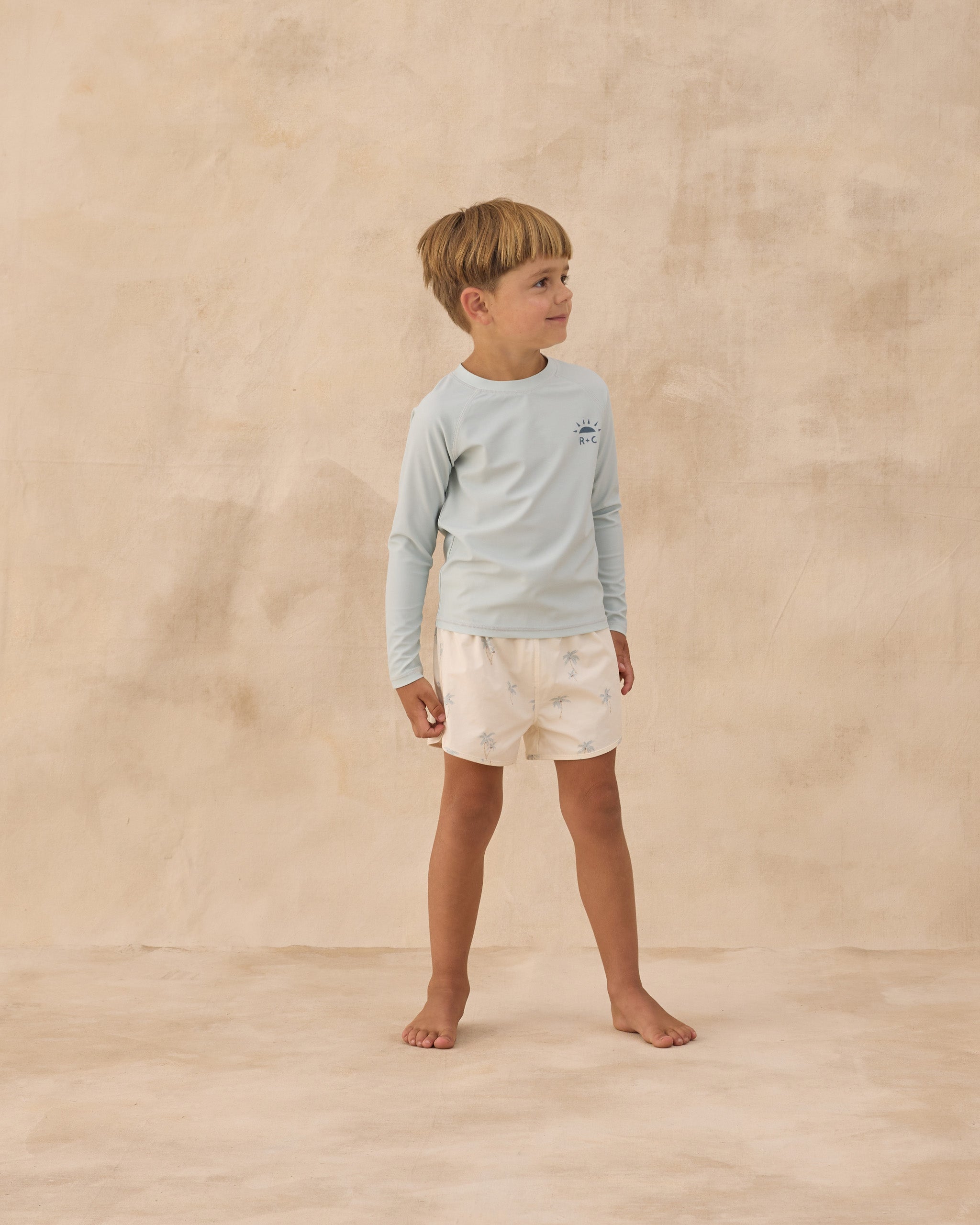 Boy wearing Long Sleeve Rashguard Seafoam | Rylee + Cru