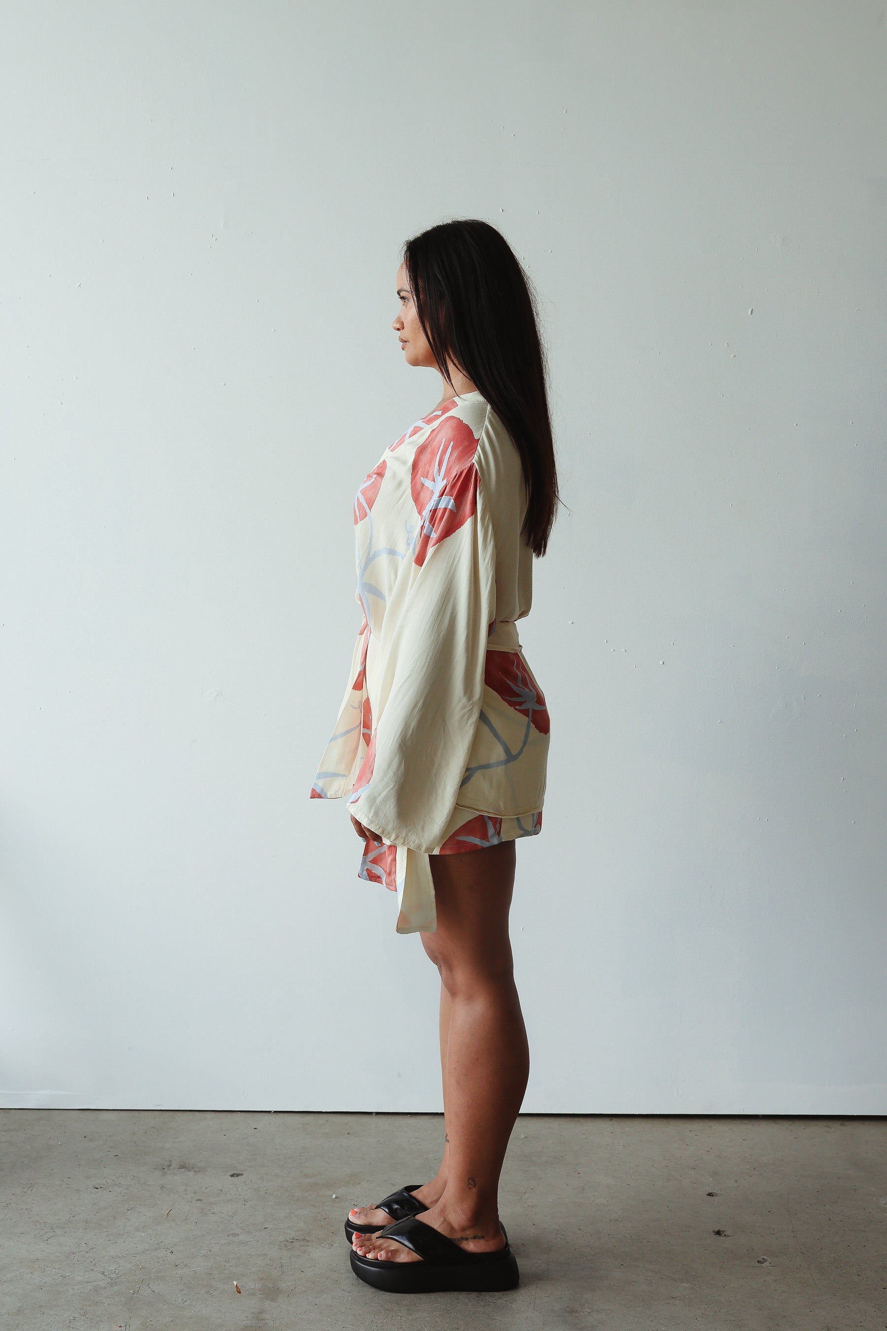 side view of model wearing Luella Kimono - Tomato Print by By Billie