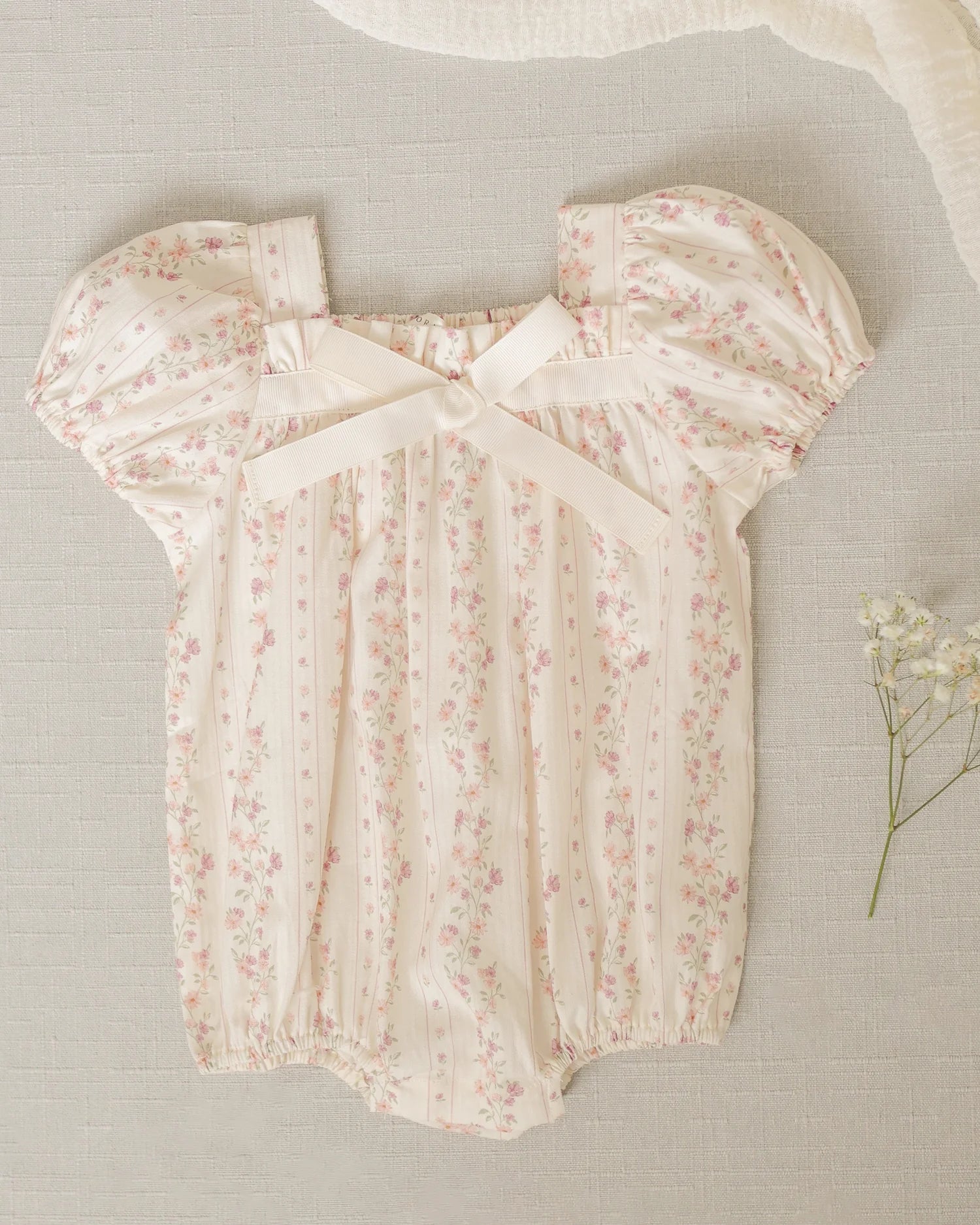 Flat lay of Lyla Romper Floral Stripe by Noralee