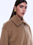 Close-up of Maeve Wool Blend Bomber showing camel colored wool texture and zip front collar detail
