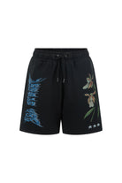 Flat lay of Sea Street washed black track shorts showing metallic blue text and pink floral print details