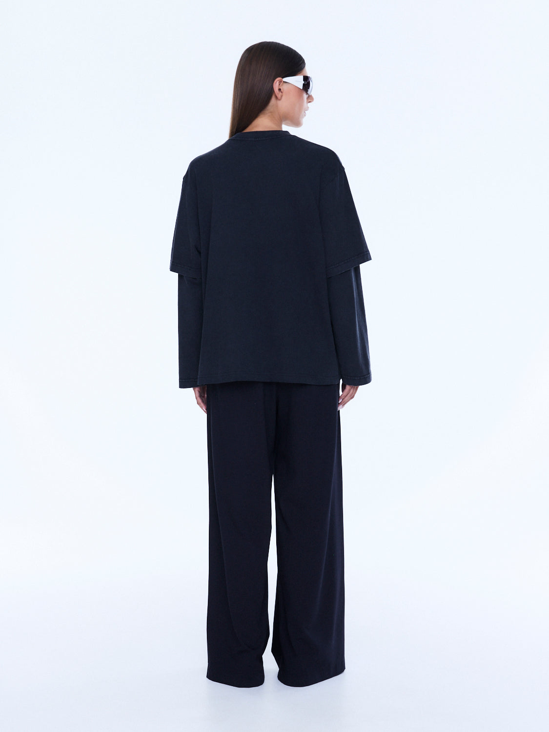 Back view of Mock Layer Long Sleeve Tee showing plain vintage black rear design and layered construction
