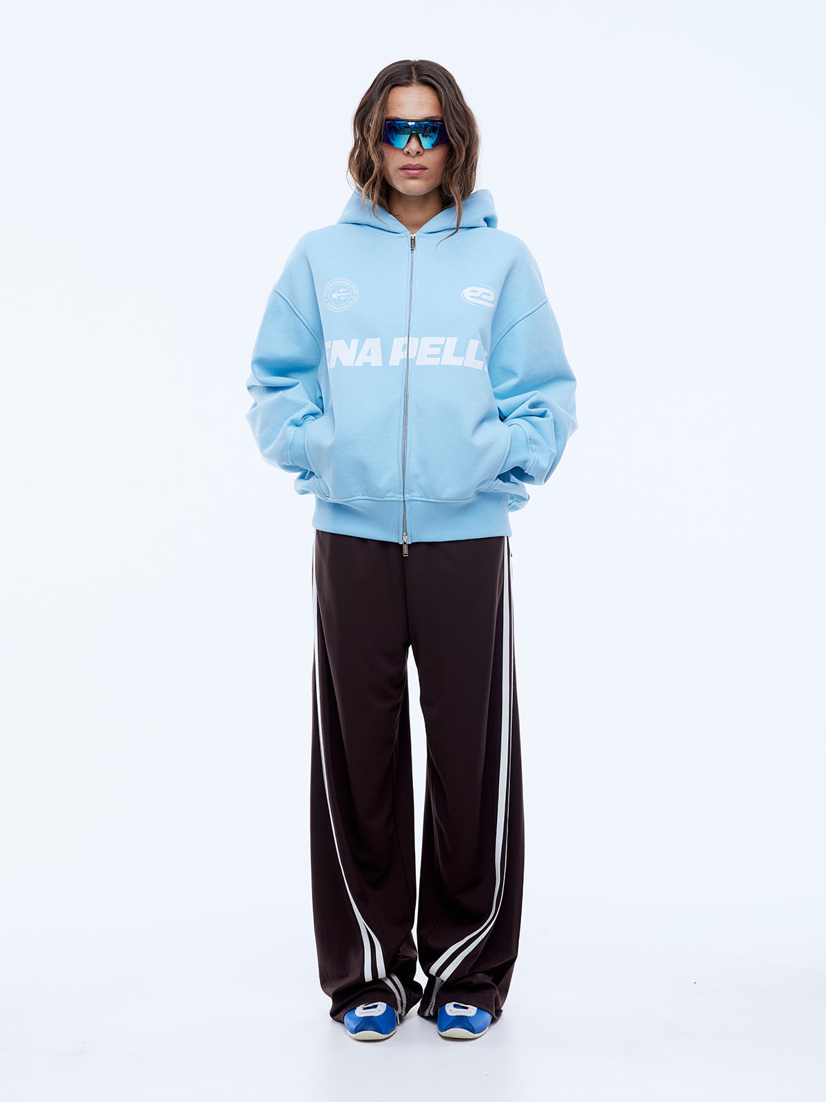 Full body front view of cloud blue multi logo hoodie with zip closure and oversized fit
