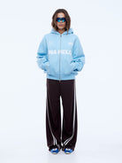 Full body front view of cloud blue multi logo hoodie with zip closure and oversized fit