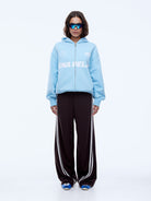 Full body front view of Multi Logo Zip Thru Hoodie in cloud blue with oversized fit