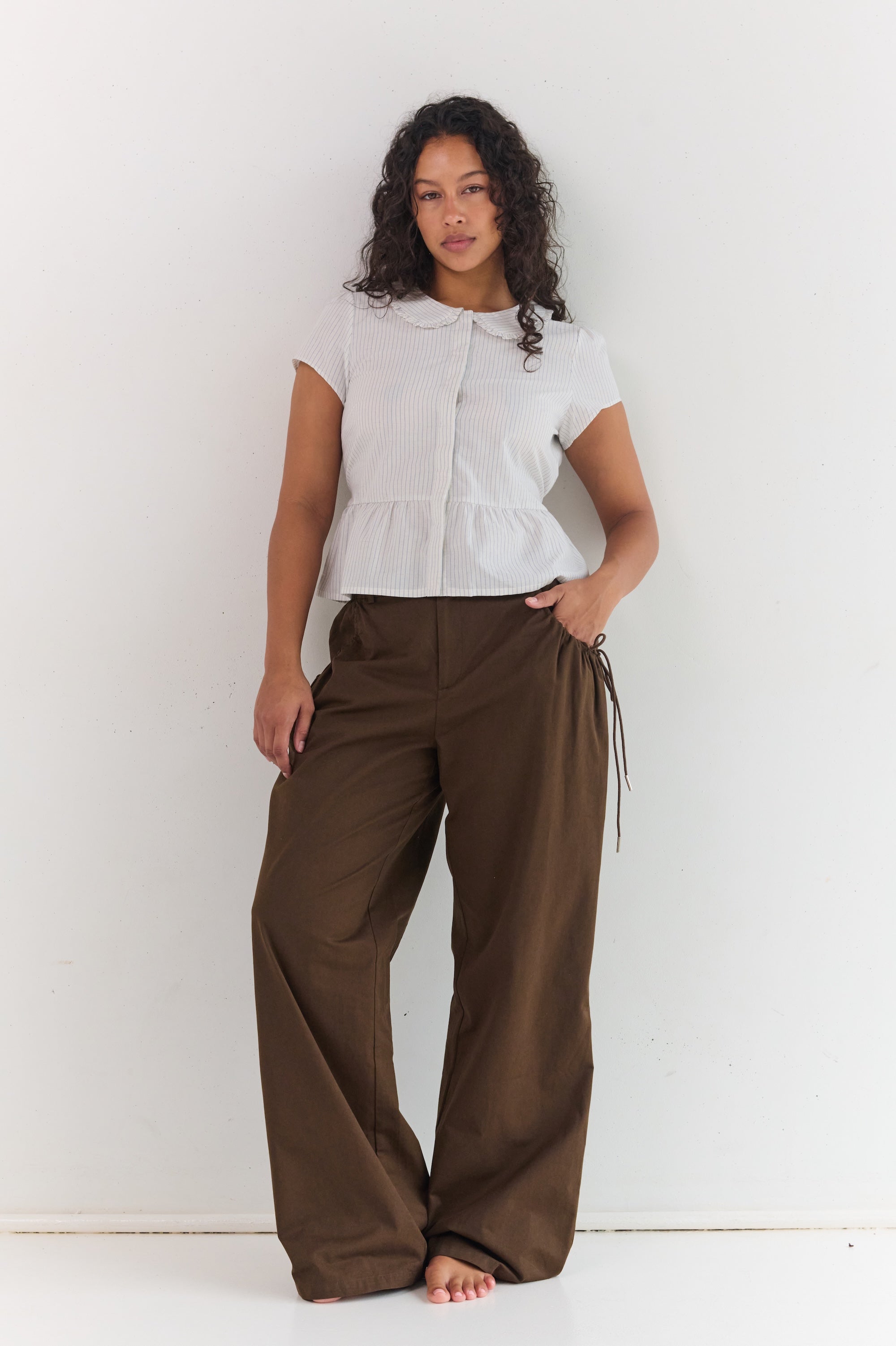 Relaxed fit espresso pants with ruched pocket detailing