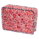 Magnolia Vanity Bag in Poppy — quilted pink and red floral print with checkered border trim, front angle
