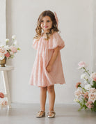 Pinks flowergirl dress with heart details and puff sleeves by Noralee