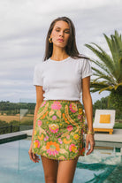 Front view Maison mini skirt showing invisible zip entry and curved wrap shape