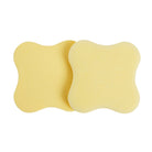Set of 2 aspen gold resin coasters with curved square shape, smooth pale yellow finish, angled top view