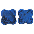 Flat lay of blue marble coaster set showing scalloped edge design and natural stone patterns