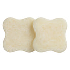 Set of 2 pearl cream marbled resin coasters with curved square shape, soft ivory swirl texture, top view