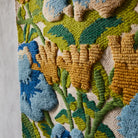 woven wool detals of the Margaret Woven Wall Hanging by Sage & Clare - blue, green and yellow floral wall hanging
