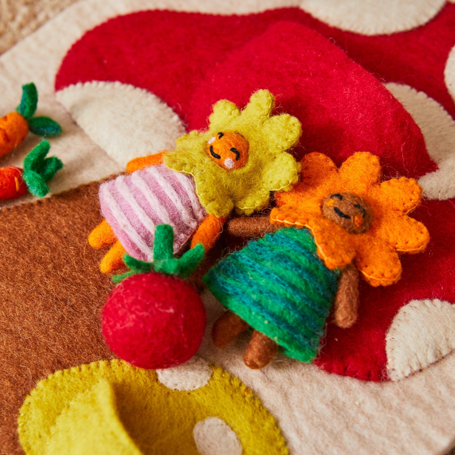 Individual felt play pieces including sun flowers, carrots, basket and tomato for mushroom wall hanging
