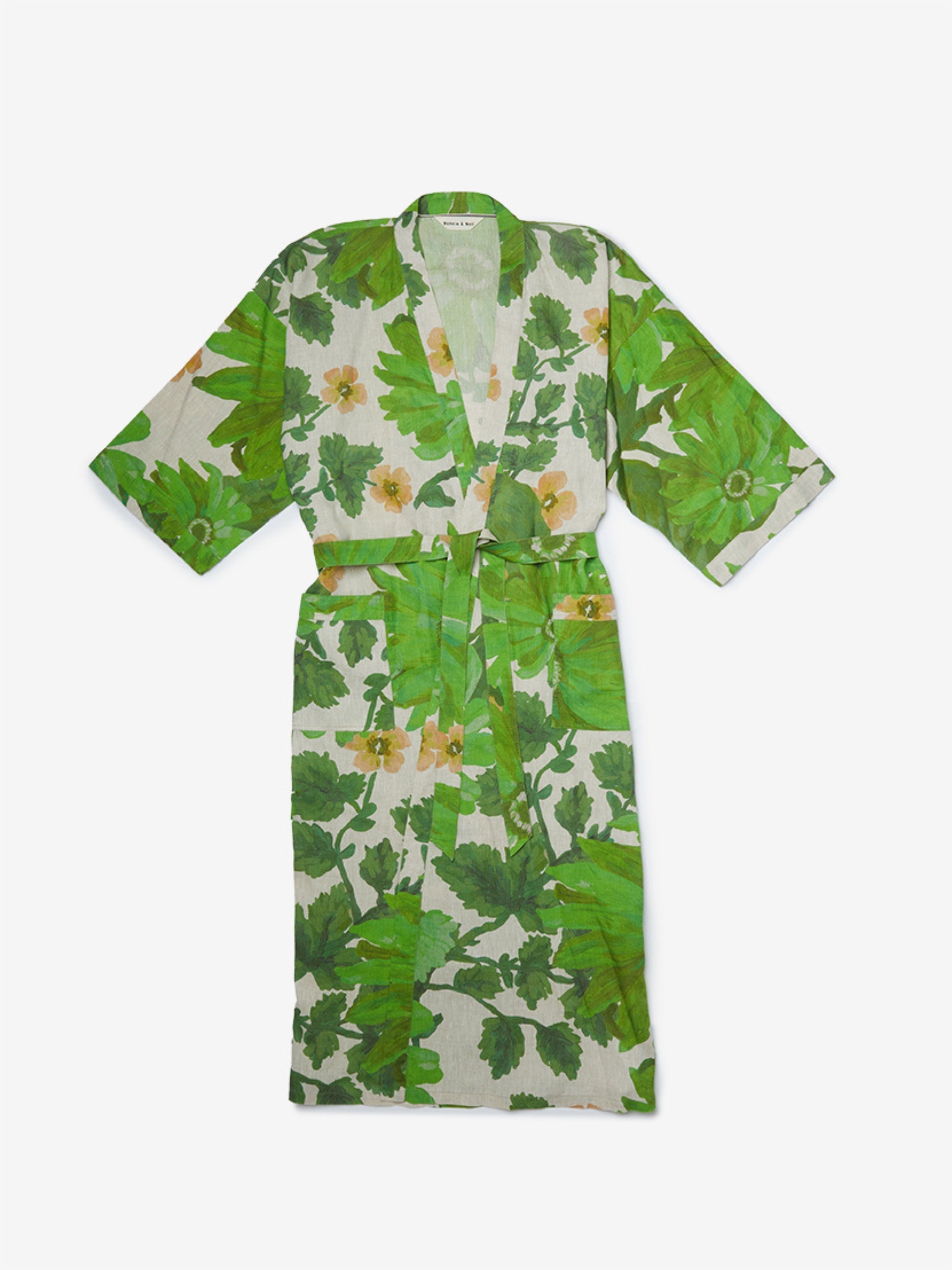 Front view of Marigold Leaf Linen Robe with green botanical print and yellow flowers showing tie belt closure