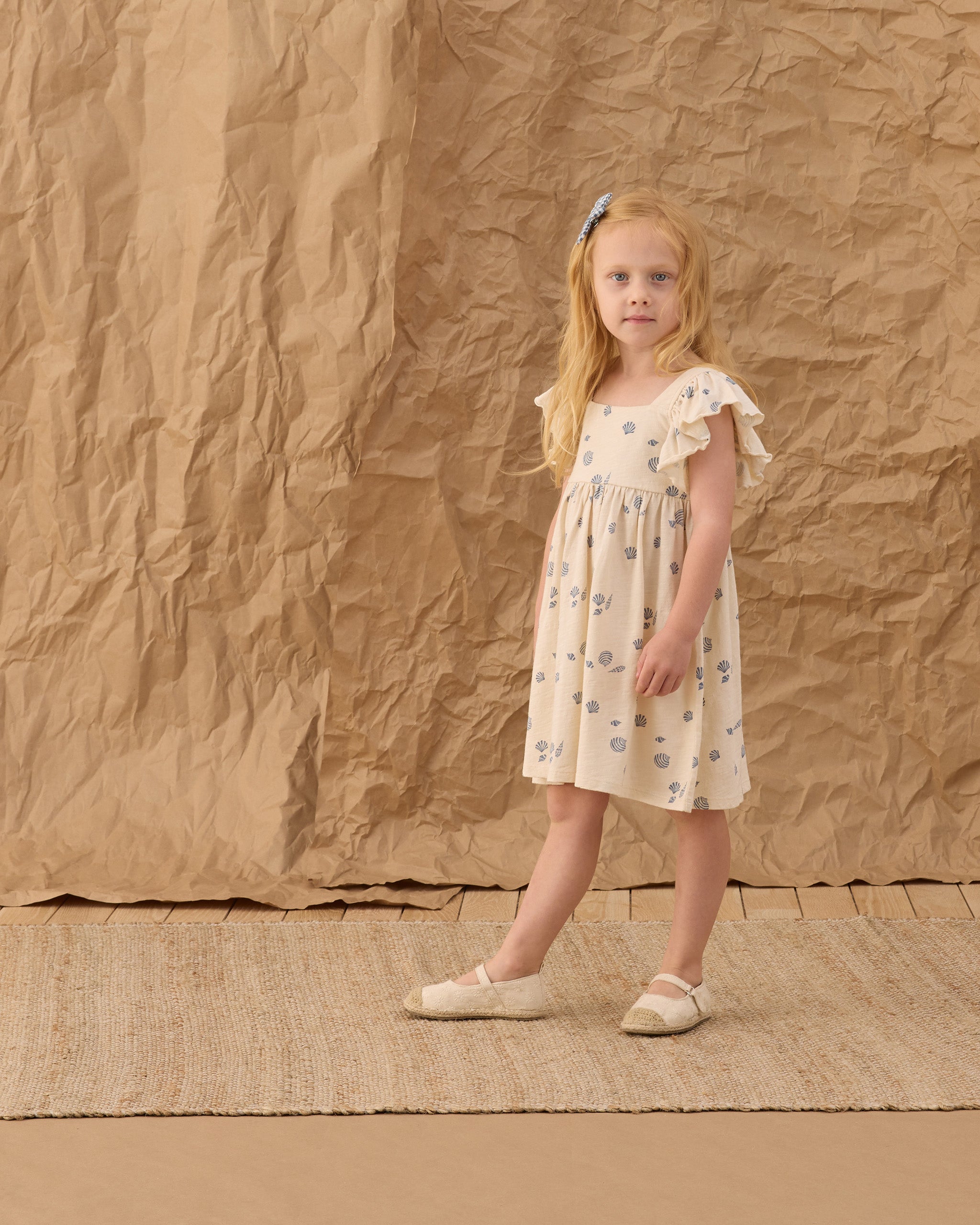 Girl wearing Mariposa Seashell Dress | Rylee + Cru