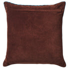 Reverse side of the Marnie velvet cushion in plain deep brown velvet with a hidden zip closure and teal piping