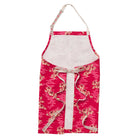 Flat lay of Marta Cotton Apron displaying front pockets and full floral cotton construction