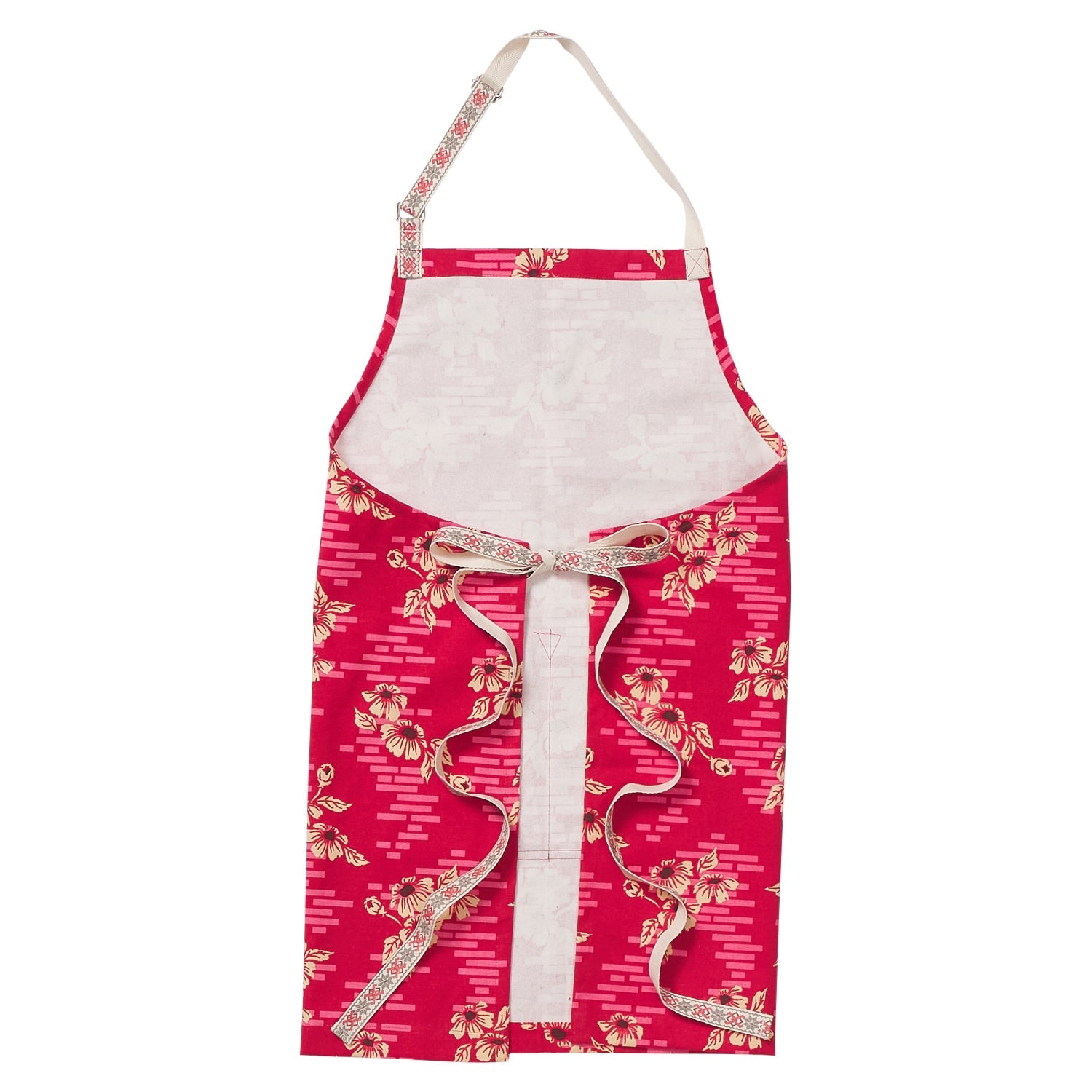 Flat lay of Marta Cotton Apron displaying front pockets and full floral cotton construction