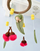 Baby cot mobile featuring red gum blossoms and gumnut baby 