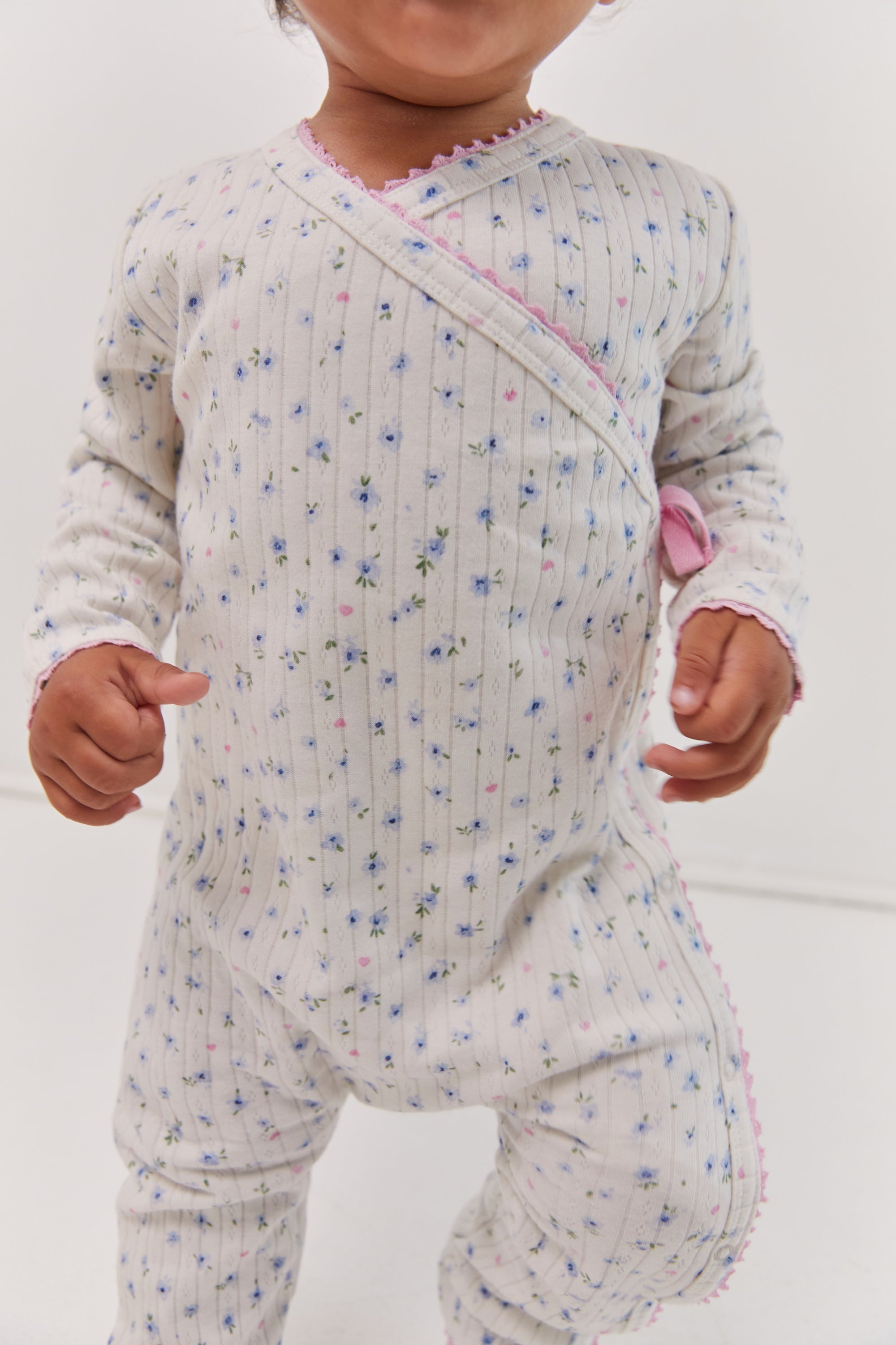 toddler wearing Pointelle baby bodysuit ethical fashion Juni brand