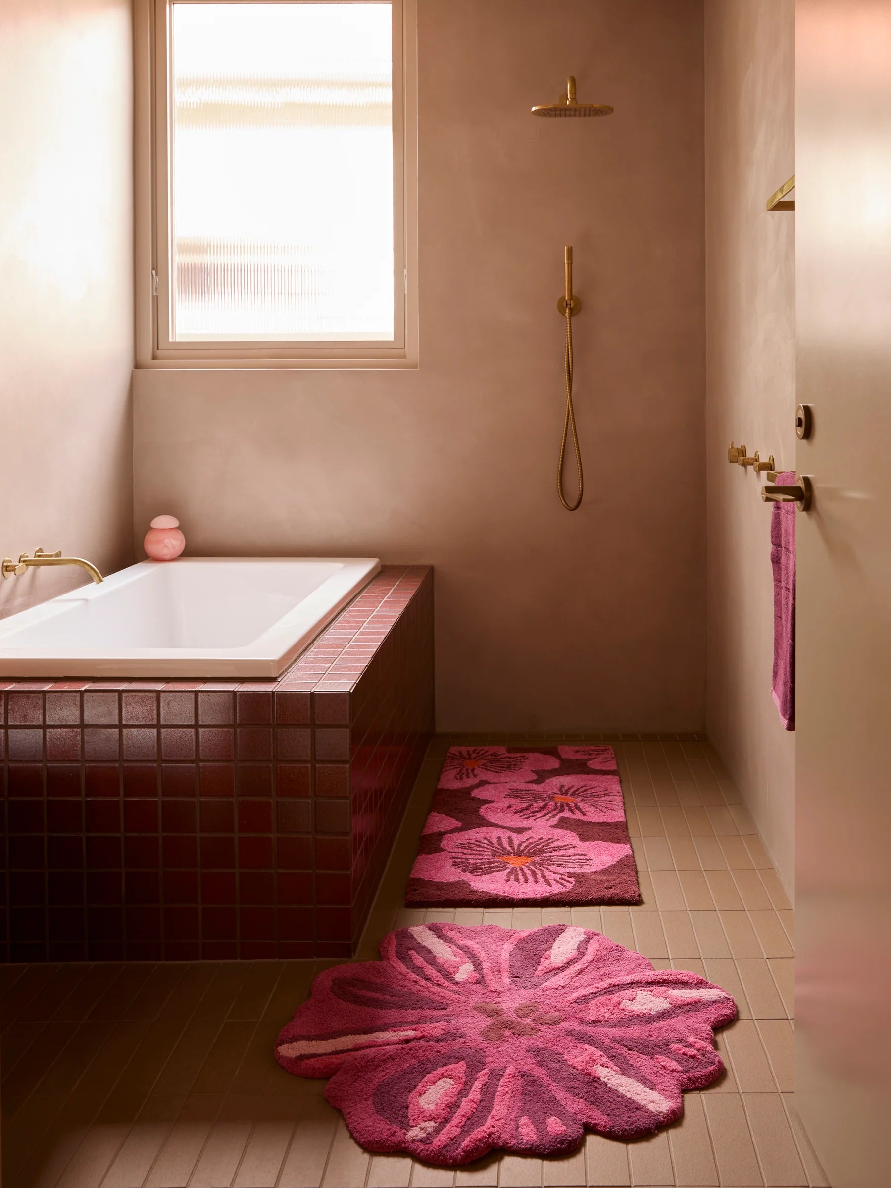 Bonnie & Neil pink flower bath mat and pink flower bath runner displayed in a pink bathroom 