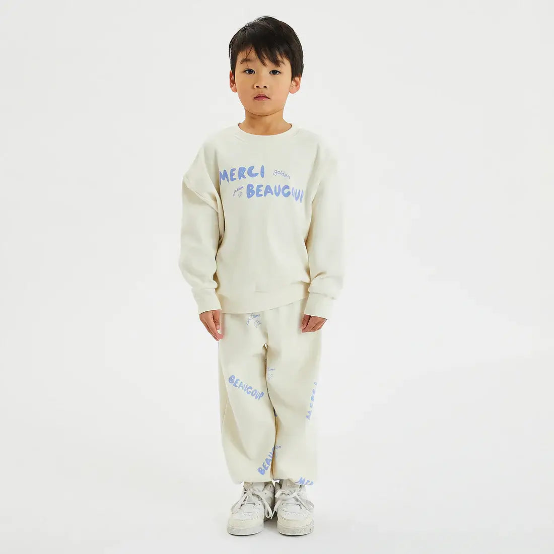 boy wearing Merci Lounge Pant eggnog by Golden Children