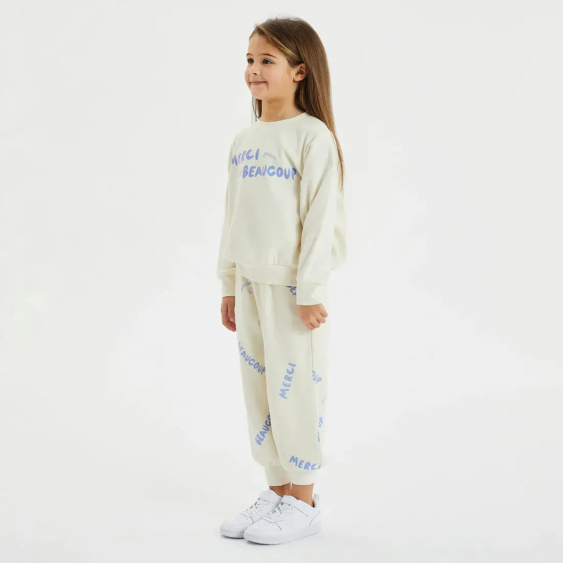 girl wearing Merci Lounge Pant eggnog by Golden Children