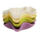 Orchid ceramic bowl photographed at angle showing organic wavy edges and interior depth