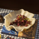 Stack of colorful ceramic bowls showing pearl bowl nested with yellow green and purple bowls