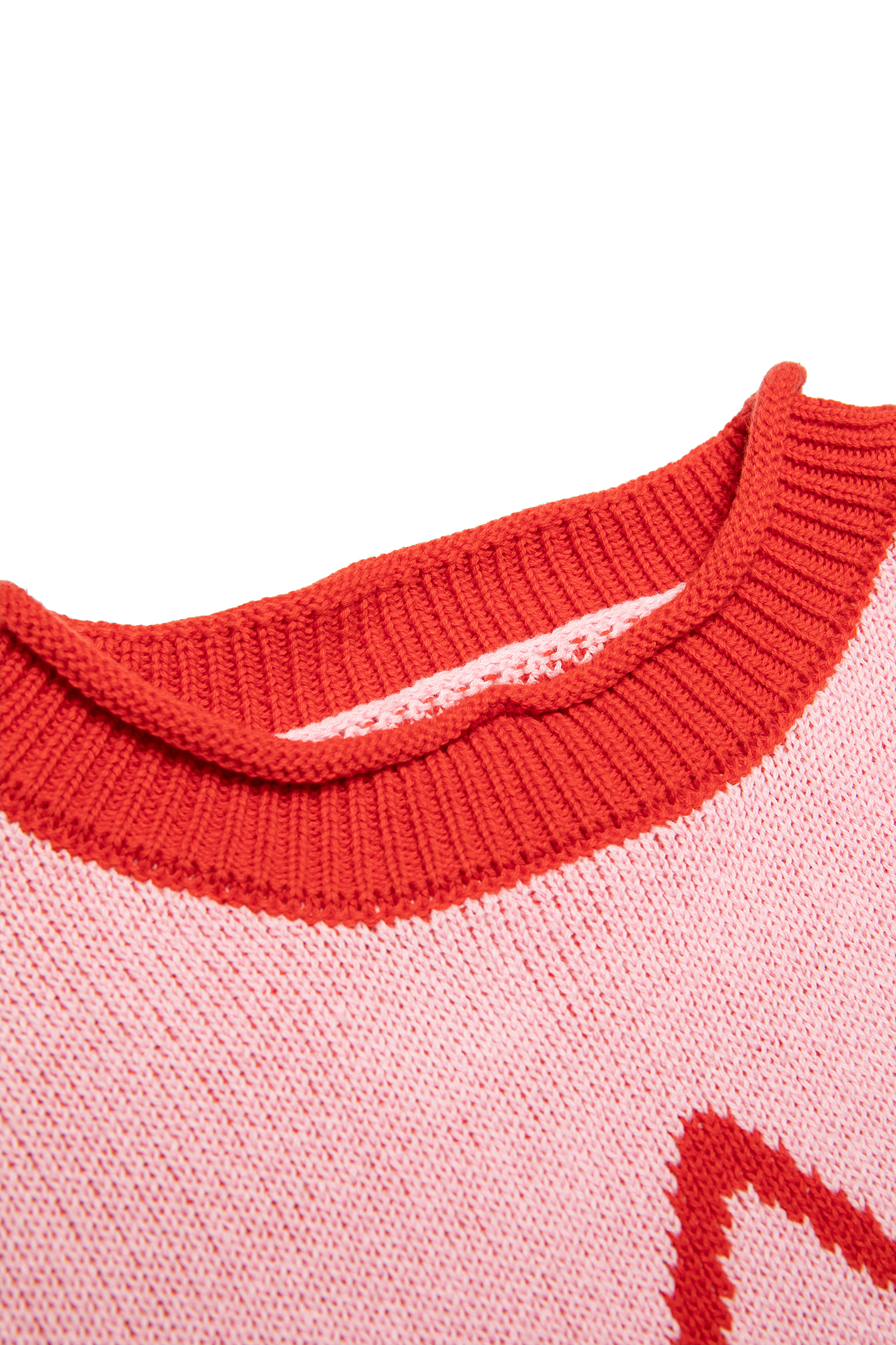Close-up of red ribbed crew neckline detail on pink Neve Knit sweater