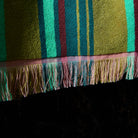 Close-up detail of Nicolette bath sheet fringed border and lightweight terry cotton weave texture