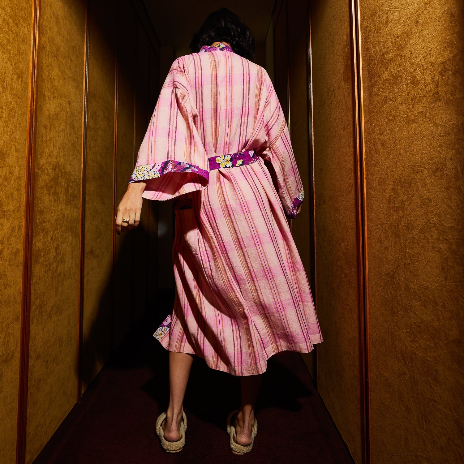Back view of Nicolette Linen Robe in Poudre showing pink striped pattern and purple floral trim details
