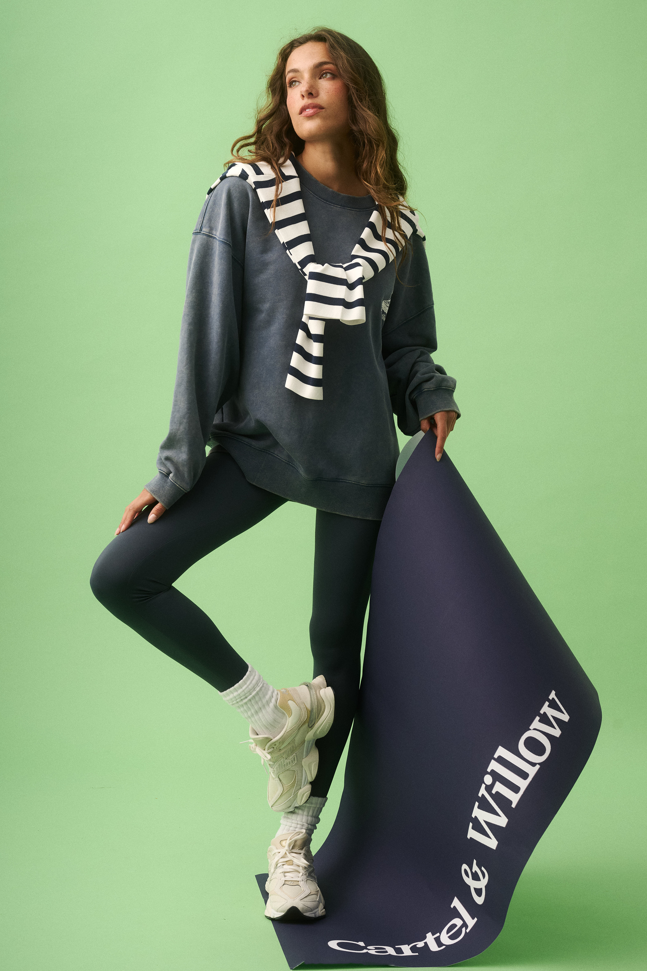 Front view of Nina Sweater in blue with striped scarf styled over oversized relaxed fit sweatshirt