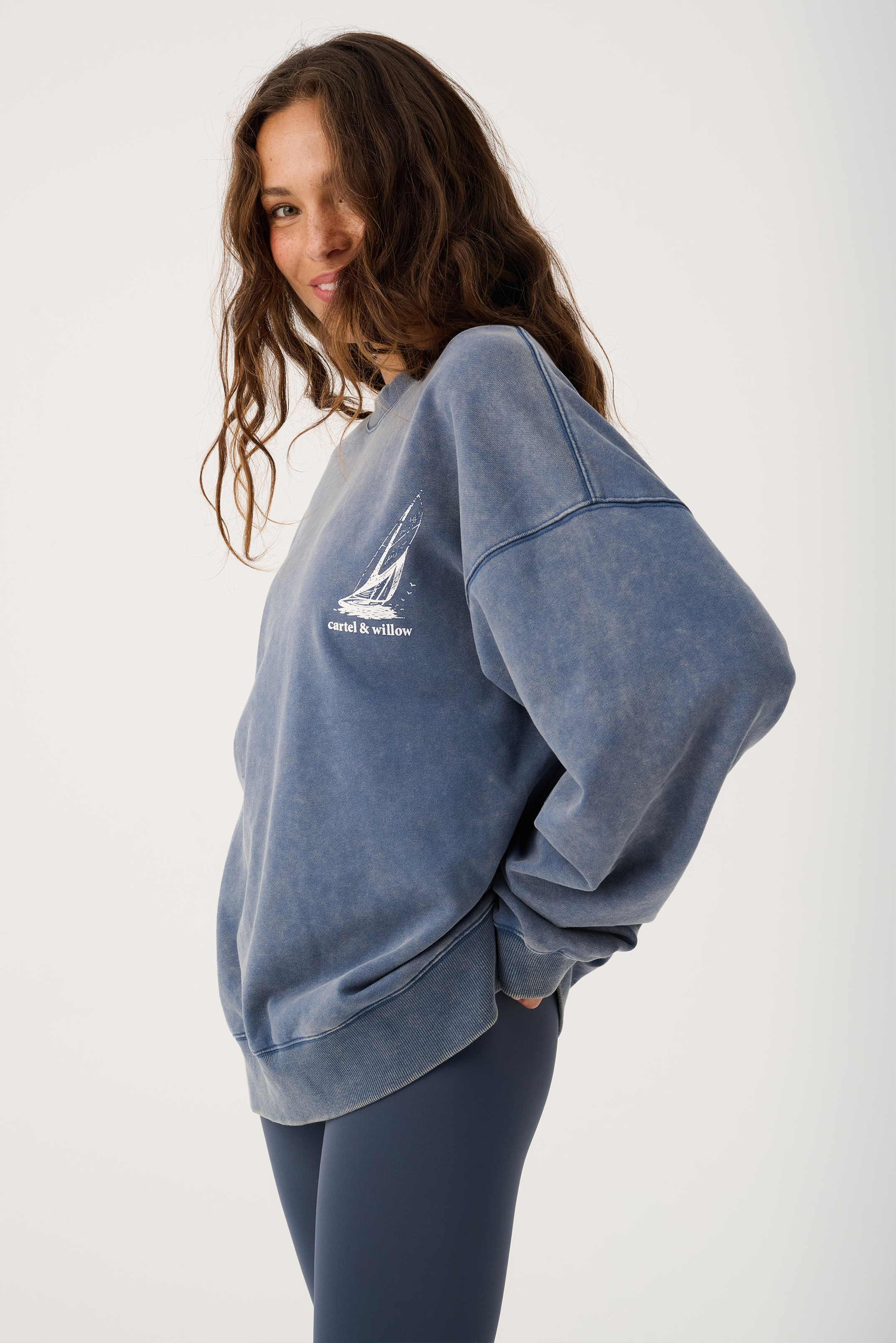 Side angle of Nina Sweater displaying relaxed oversized silhouette and ribbed cuffs and hem