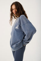 Side angle of Nina Sweater displaying relaxed oversized silhouette and ribbed cuffs and hem