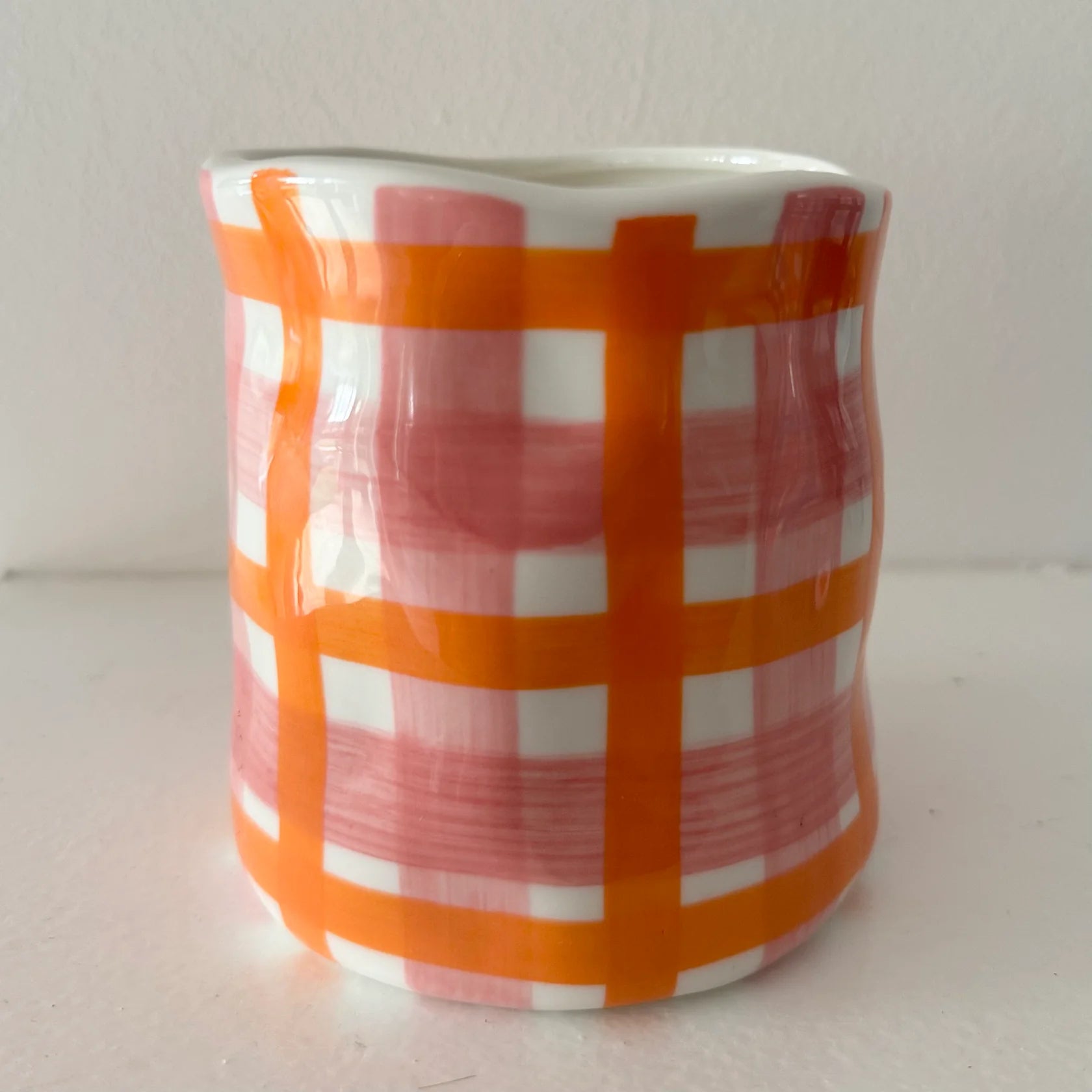 Noss and Co candle in pink and orange gingham