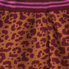 Fabric detail of Odette Kids Knit Pants in leopard print with pink stripes by Sage and Clare