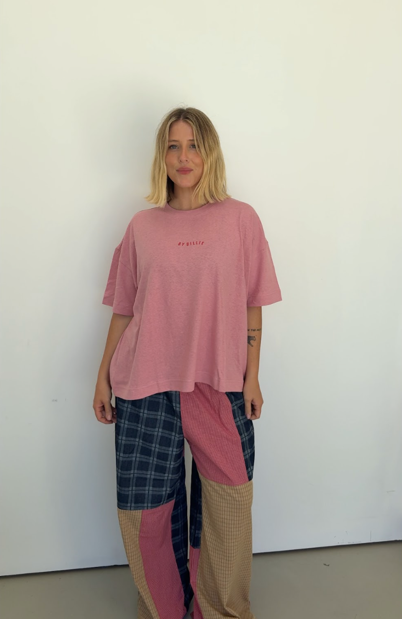 Full length view of Olive Checkerboard Pant displaying patchwork colorblocking and loose fit