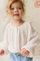 Young girl in the Organic Cotton Muslin Heather Blouse - Pauline Pink | Jamie Kay