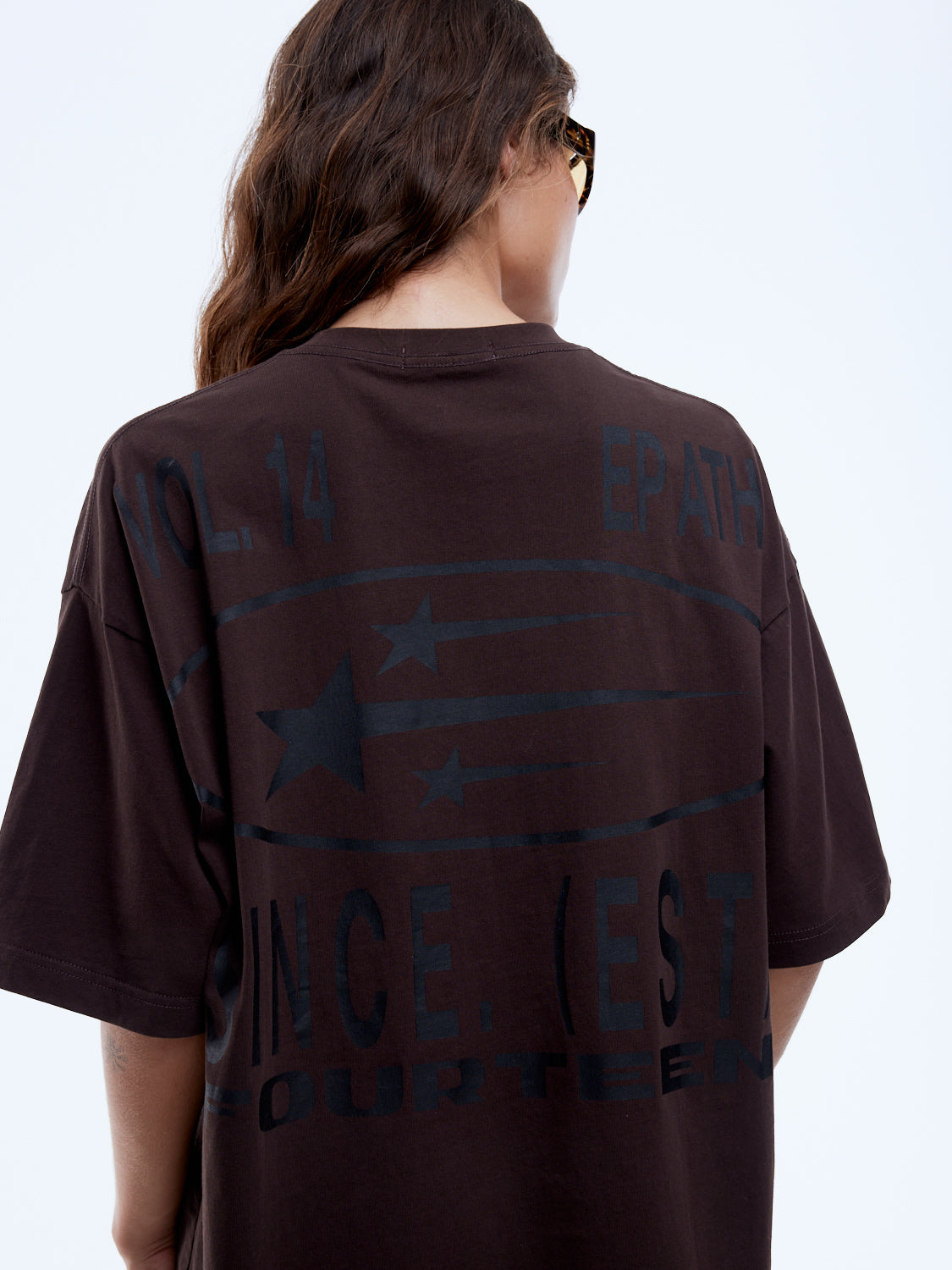 Back view of Sport Star Tee showing blue graphic print with stars and text design