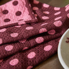 Close-up of waffle weave texture on Paige Tea Towel Rosewood showing absorbent fabric and spot pattern detail