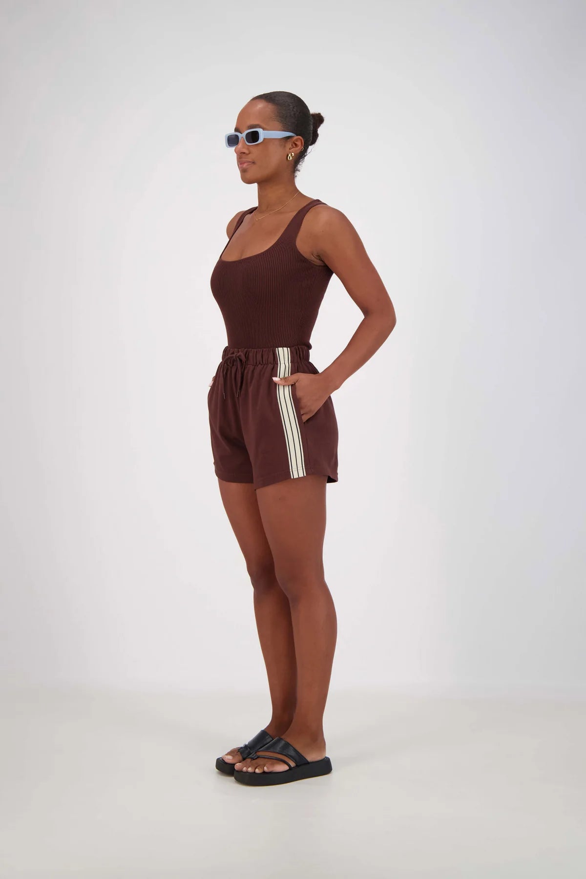 side view of model wearing Panarea Shorts – Brown by Jasmine Alexa