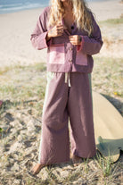 Beach lifestyle photo of houndstooth patchwork over shirt with button-up front and relaxed fit