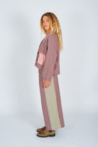 Side profile view of lined patchwork over shirt displaying colorblock panels and oversized silhouette