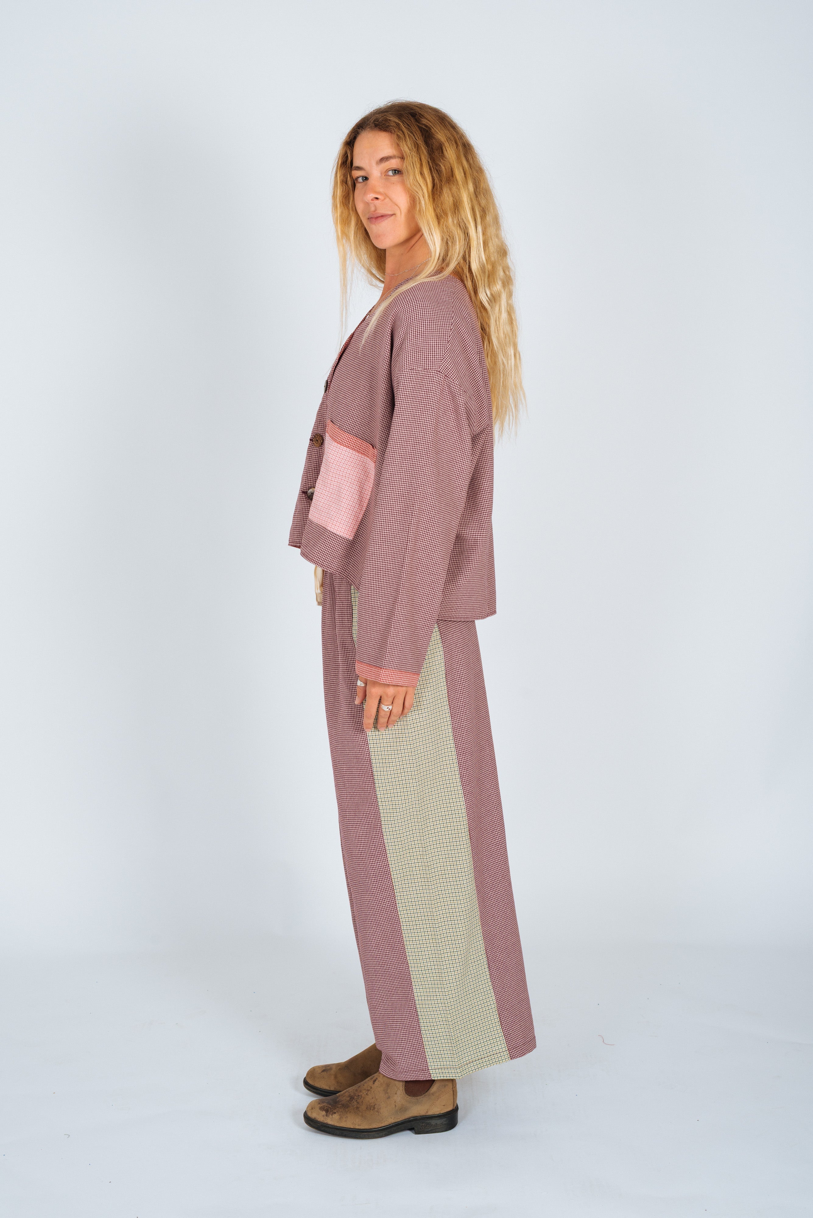 Side profile view of lined patchwork over shirt displaying colorblock panels and oversized silhouette