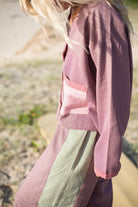Close-up detail of houndstooth fabric texture and patchwork construction on Atmosea over shirt
