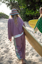 Front view of woman wearing Atmosea Patchwork Pant Houndstooth Combo with white drawstring